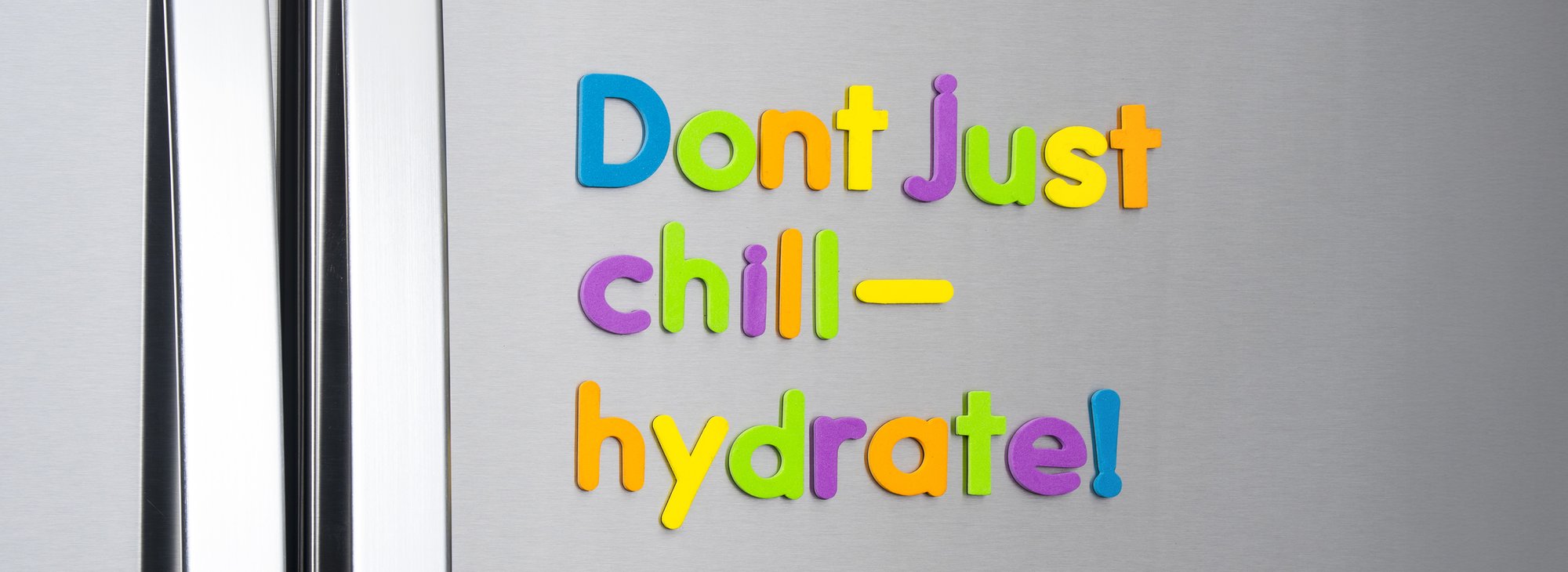 Don't Just Chill – Hydrate! written in magnetic letters on a fridge door